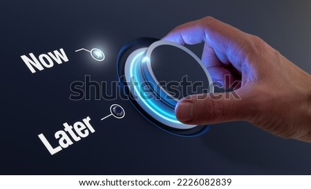 Now versus Later words, stop procrastinating concept. Time management, personal development, business strategy, decision making. Take action, avoid postponing. Hand turning knob. Royalty-Free Stock Photo #2226082839