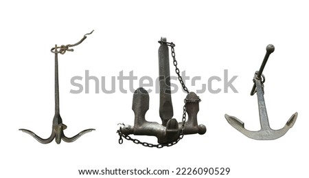 Iron black old rusty naval anchor isolated on a white background.