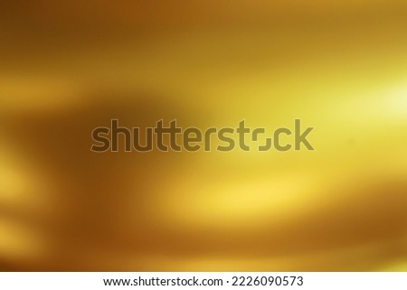 Beautifully flowing golden abstract background blur