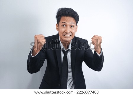 Angry, tired, grumpy, grumpy young office manager or annoyed business man losing control and screaming hysterically isolated on white background