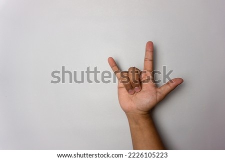 rocker hand gesture isolated on white background. symbol of rock and coolness. I love you  gesture in sign language