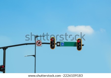 Traffic lights with red sign on city street. Road rules