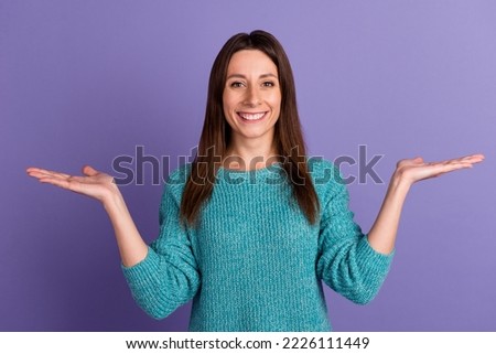 Photo of young cheerful woman hold hands pros cons proposition advert isolated over violet color background.