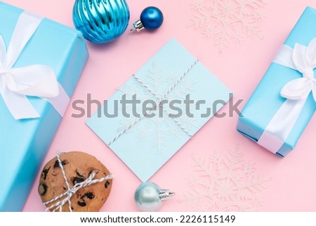 Letter to Santa with cookies, presents and Christmas decor on pink background