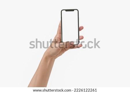 Smartphone in female hands taking photo isolated on white blackground Royalty-Free Stock Photo #2226122261