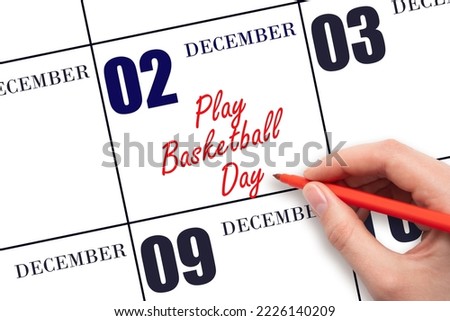 December 2nd. Hand writing text Play Basketball Day on calendar date. Save the date. Holiday. Day of the year concept.