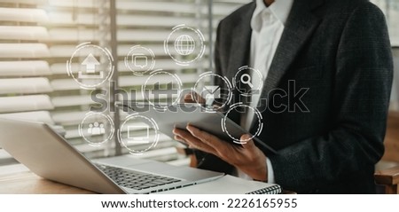 Digital marketing media (website ad, email, social network, mobile app) in virtual screen.Designer hand using tablet payments online shopping,omni channel,laptop computer on desk. Royalty-Free Stock Photo #2226165955