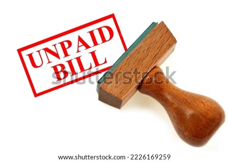 Rubber stamp showing unpaid bill close up on white background Royalty-Free Stock Photo #2226169259