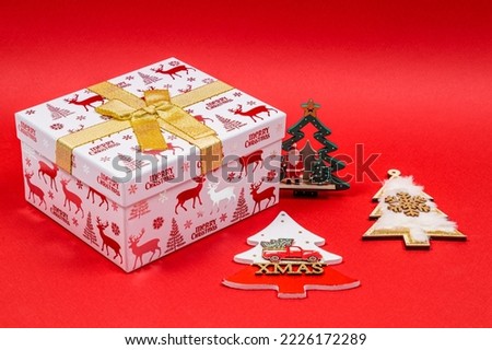 New Year banner for the site, a festive box with toys on a red background