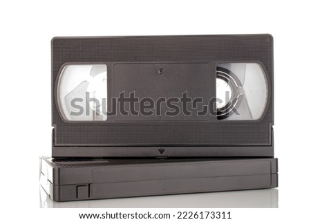 Two video cassettes, macro, isolated on white background.