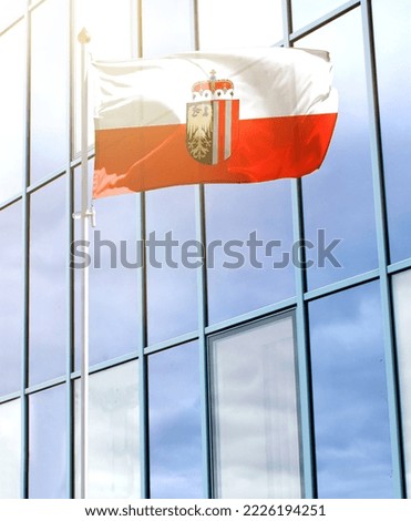 Flag of Upper Austria on a flagpole