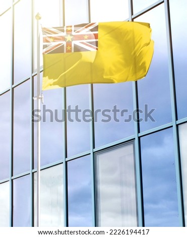 Flag of Niue on a flagpole
