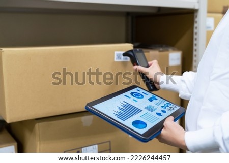 Warehouse management system with barcode reader and tablet PC. Inventory control. Royalty-Free Stock Photo #2226244457