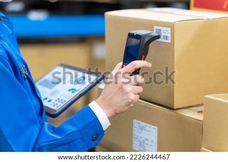Warehouse management system with barcode reader and tablet PC. Inventory control. Royalty-Free Stock Photo #2226244467