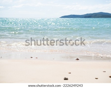 Texture Wave Water Blue Sea and Blue Sky at Coast on Sand Beach Background,Ocean Island Clouds Horizon Nature Landscape,Calm water in Morning,ฺTourism Tropical travel Shore in Holidays concept.
