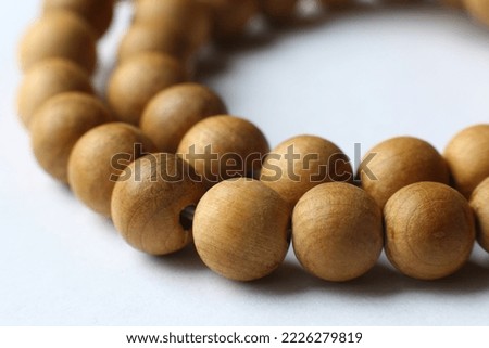 Rosary or wooden prayer beads isolated on white Royalty-Free Stock Photo #2226279819