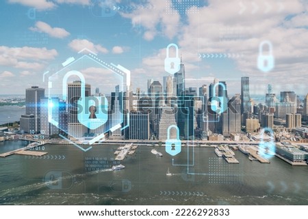 Aerial panoramic helicopter city view on Lower Manhattan district and financial Downtown, New York, USA. The concept of cyber security to protect confidential information, padlock hologram