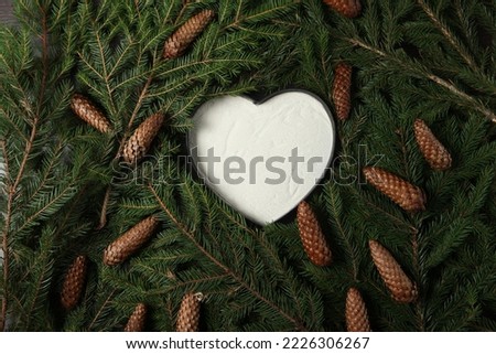 Holidays greeting card or banner composition with pine tree branches. Merry Christmas background and Happy New Year 2023.