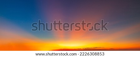 orange sky and clouds,Real amazing panoramic sunrise or sunset sky with gentle colorful clouds. Long panorama, crop it