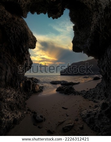 Sunset in a cave on the beach