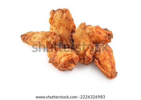 Breaded chicken drumstick, leg, wing and breast tenders strips on white background with shadow.