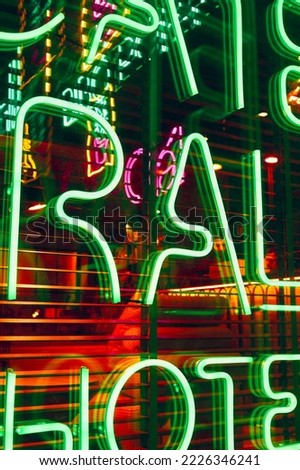 Neon abstract background. Glowing sign on the window in the city