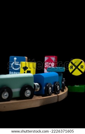 wooden train and signs waiting to be played with by tiny baby hands