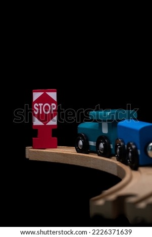 wooden train and signs waiting to be played with by tiny baby hands