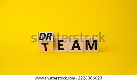 Dream Team symbol. Wooden cube with words Dream Team. Beautiful yellow background. Business and Dream Team concept. Copy space. Royalty-Free Stock Photo #2226386023