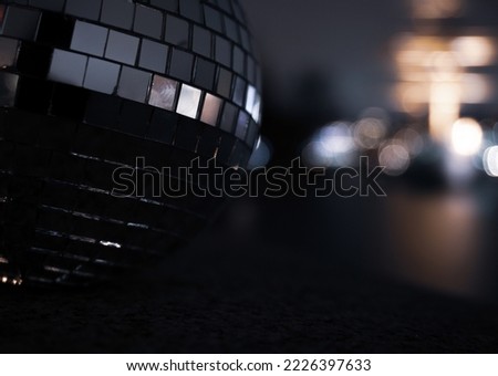 Close-up of illuminated disco ball during night 