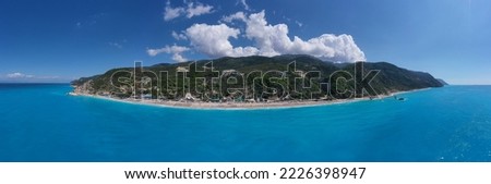 Aerial drone panoramic wide photo of famous paradise bay and beach of Kathisma with deep turquoise sea in island of Lefkada, Ionian, Greece
