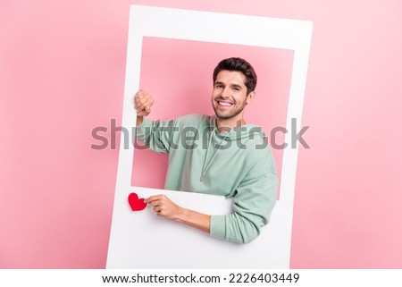 Portrait of positive person hands hold paper window card little heart like isolated on pink color background