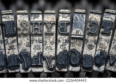 Photo of parts of a worn-out white manual typewriter.