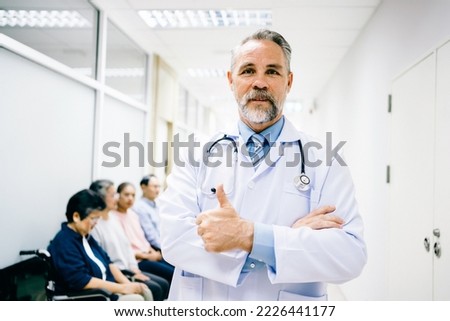 Portrait of a Doctor in uniform standing cross-arms and thumping up looking confident in the hospital hallway, services medical and health care concepts. Royalty-Free Stock Photo #2226441177