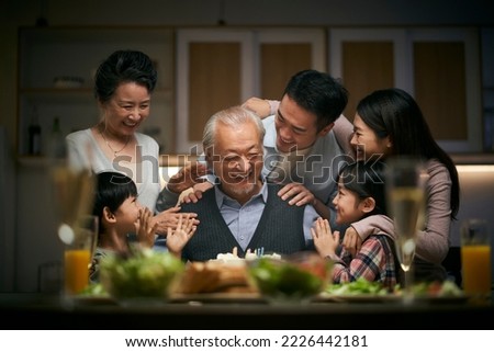 happy three generation asian family celebrating grandpa's birthday at home Royalty-Free Stock Photo #2226442181
