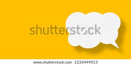 white cloud paper speech bubble on yellow background.design Royalty-Free Stock Photo #2226449013