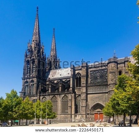 Towering over Clermont-Ferrand city gothic cathedral Notre-Dame-de-l'Assomption building from black lava, France Royalty-Free Stock Photo #2226450171