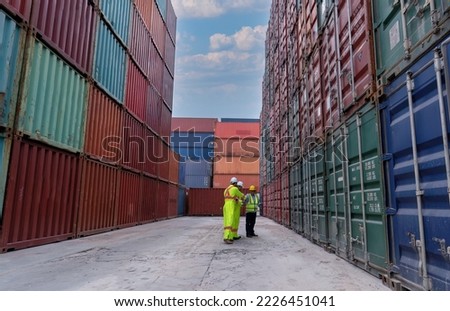Worker in container storage yard check quantity counting and record to tablet for right location