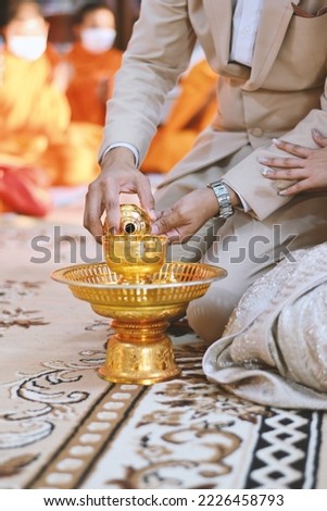 pour ceremonial water in thai wedding ceremony tradition concept