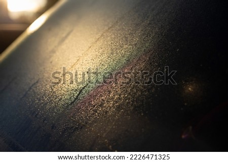 Glass condensate. Water drops on glass. Car in detail. Light on back window.