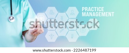 Practice Management. Male doctor pointing finger at digital hologram made of icons. Text with medical term. Concept for digitalization in medicine Royalty-Free Stock Photo #2226487199