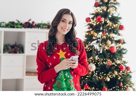 Photo of adorable cheerful lady preparing weekend hold device writing followers greeting post message enjoy best season indoors room