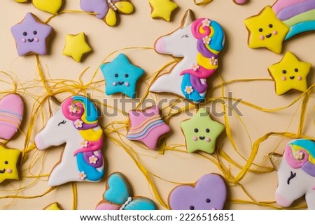Ginger cookies in colored glaze for the holiday on a light background