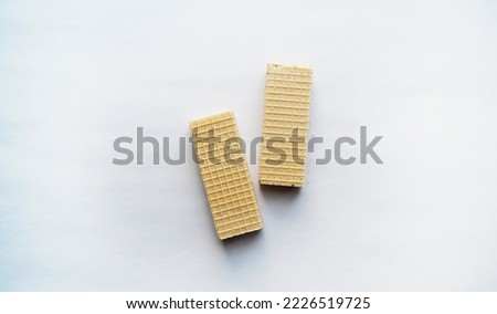 Two waffles on a white background, top view