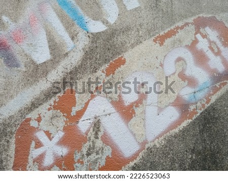 a graffiti on the wall of the house as wallpaper