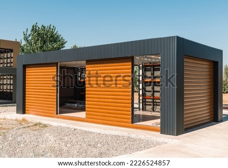 Newly built metal framed building with siding. Construction of a new tiny house. selective focus Royalty-Free Stock Photo #2226524857