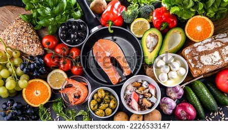 Food products representing the Mediterranean diet which may improve overall health status Royalty-Free Stock Photo #2226533147