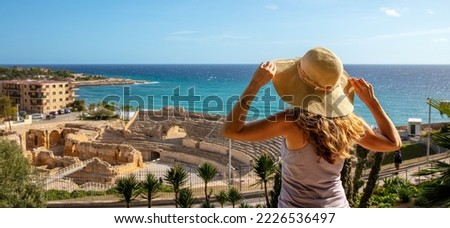 Woman tourist looking at Tarragona amphitheater,  Catalonia in Spain Royalty-Free Stock Photo #2226536497