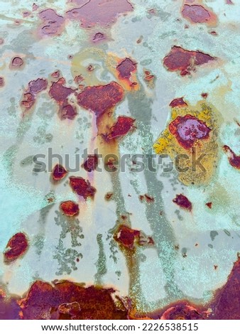 Scratched metallic surface with paint and rust stains - stock photo