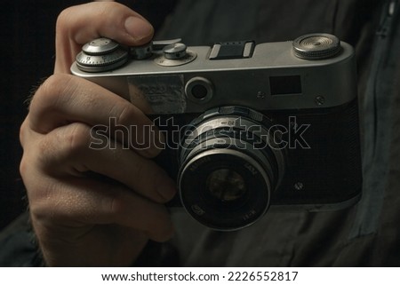 Retro film photo camera isolated on white background